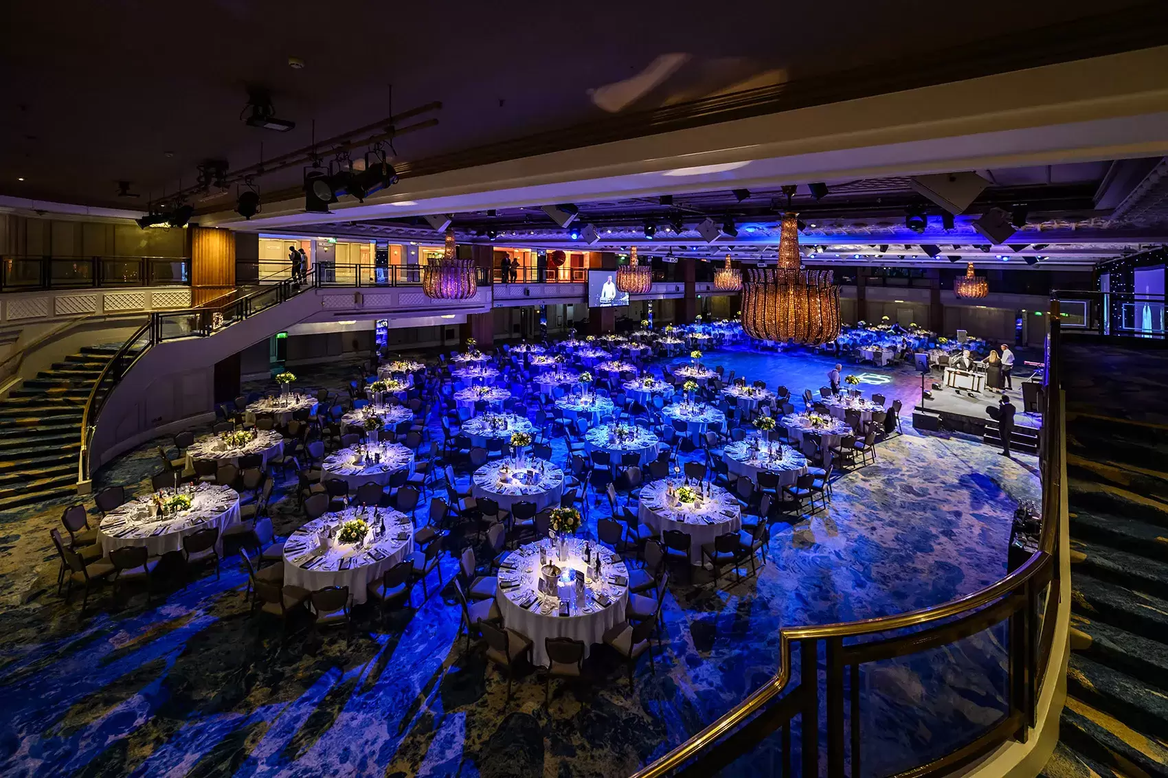 Awards dinner in the Great Room at Grosvenor House, tables set beneath stage lighting