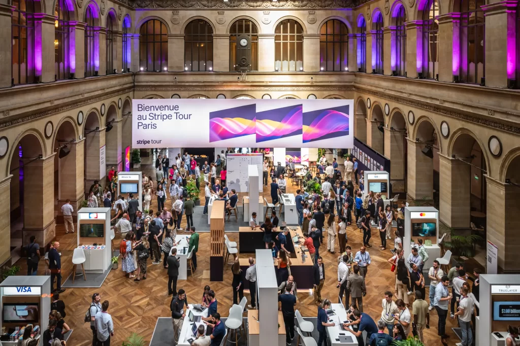 Elevated view of the exhibition hall at Palais Brongniart during Stripe Tour Paris 2025
